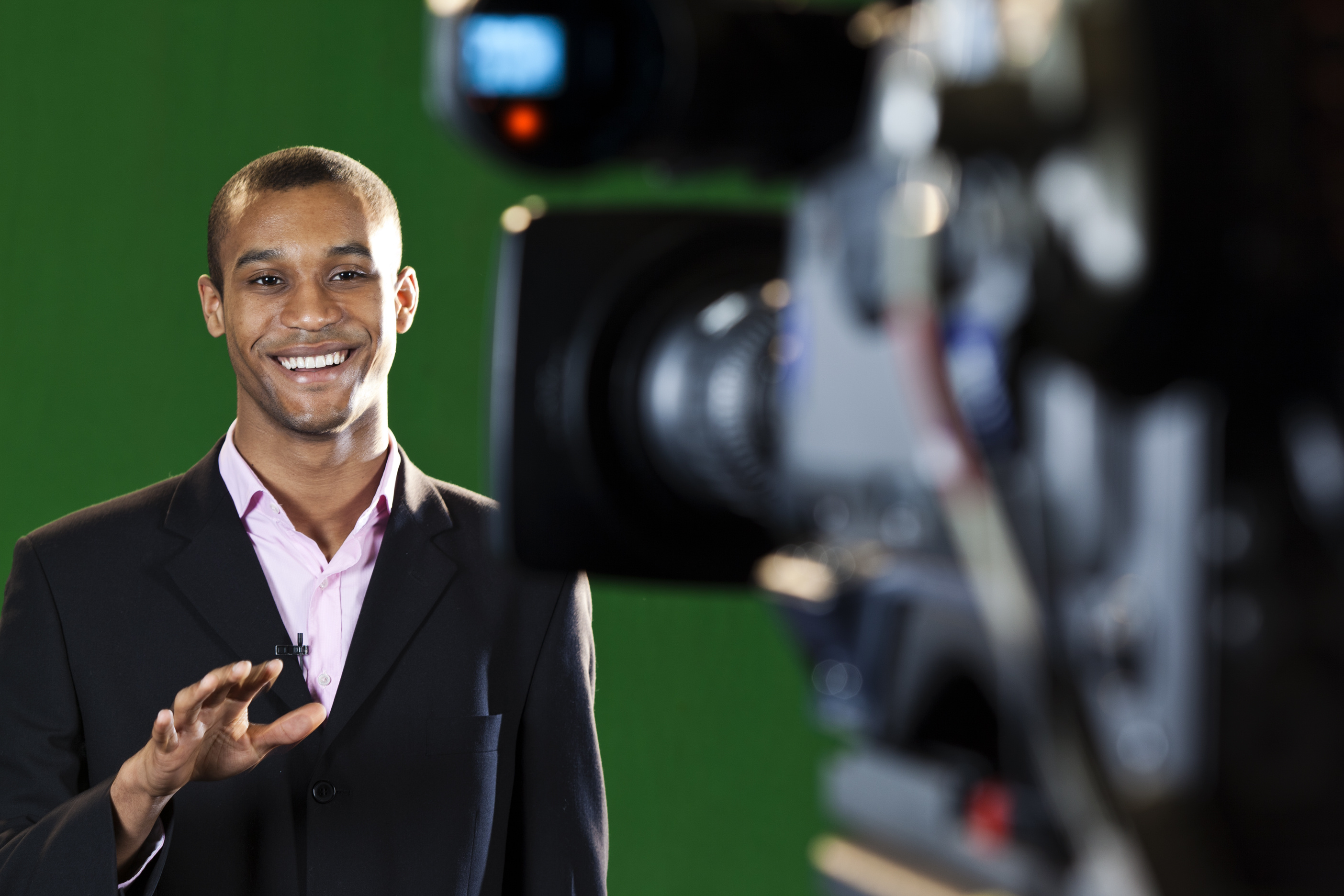 Presenter in TV Studio with foreground camera The Editing Company
